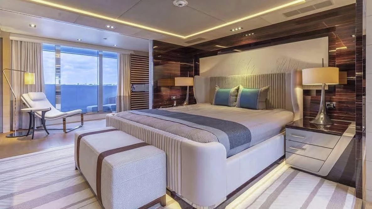 a large bed in a room aboard ILLUSION Yacht for Sale