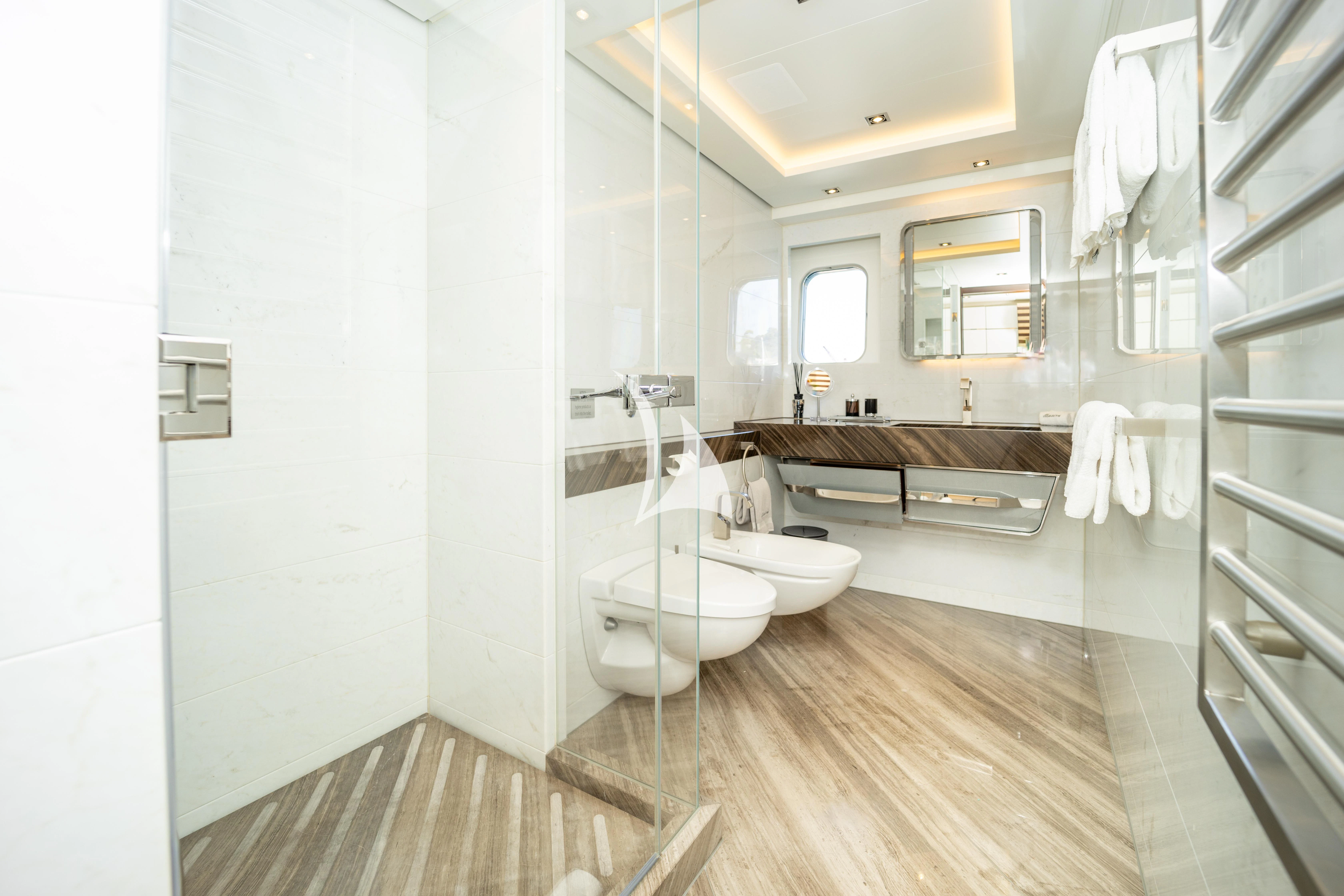 a bathroom with a large mirror aboard ILLUSION Yacht for Sale