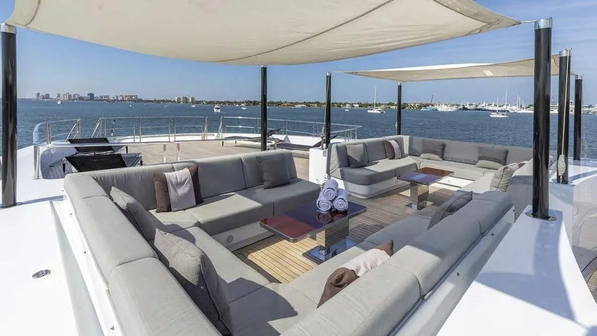 a large living room with a large patio and a large body of water aboard ILLUSION Yacht for Sale