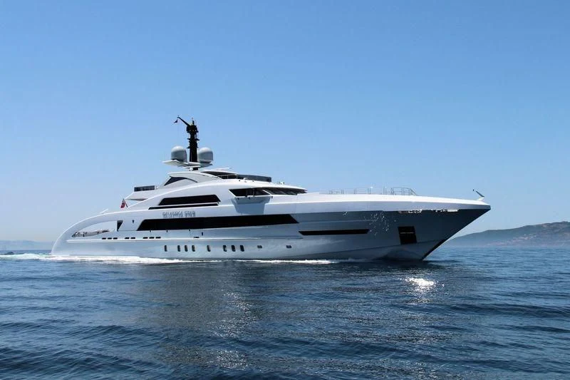 a white yacht in the water aboard ILLUSION Yacht for Sale