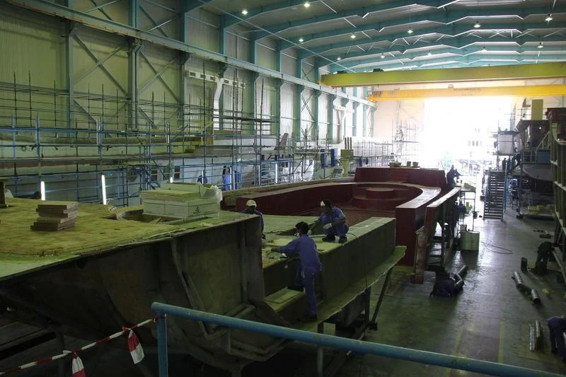 a factory with several people working aboard JEWEL Yacht for Sale