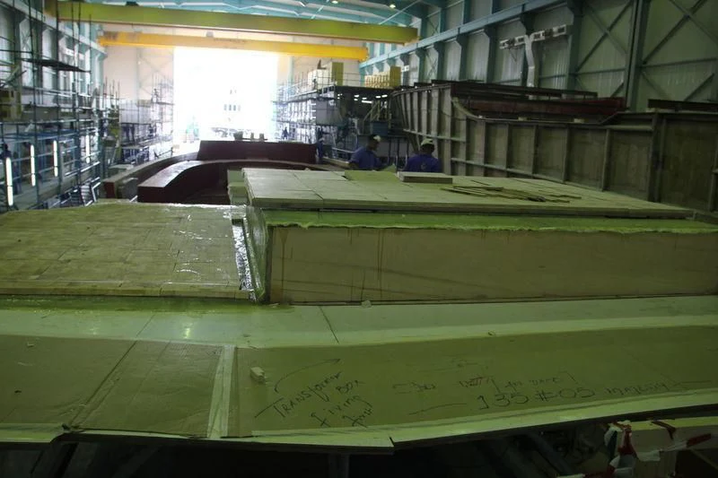 a large wooden structure with people in it aboard JEWEL Yacht for Sale