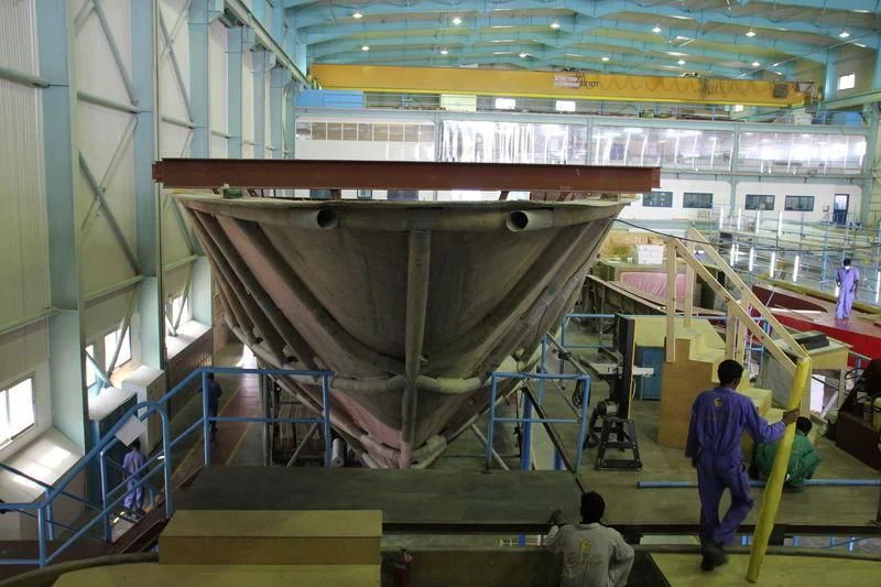 a group of people in a factory aboard JEWEL Yacht for Sale