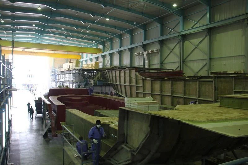 a few people in a factory aboard JEWEL Yacht for Sale