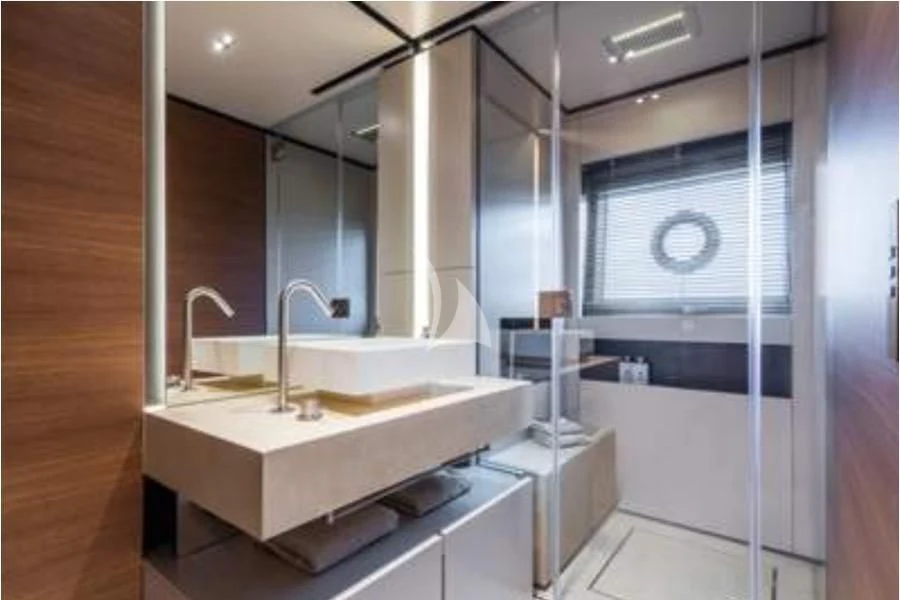 a bathroom with a large mirror aboard ALMAX TOO Yacht for Sale