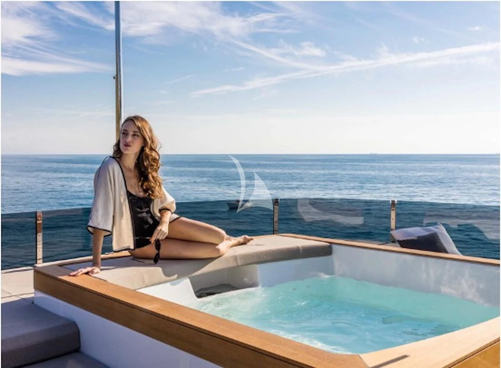 a woman sitting on a boat aboard ALMAX TOO Yacht for Sale