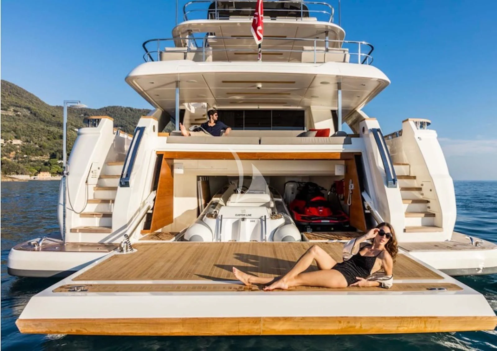 a person sitting on a boat aboard ALMAX TOO Yacht for Sale