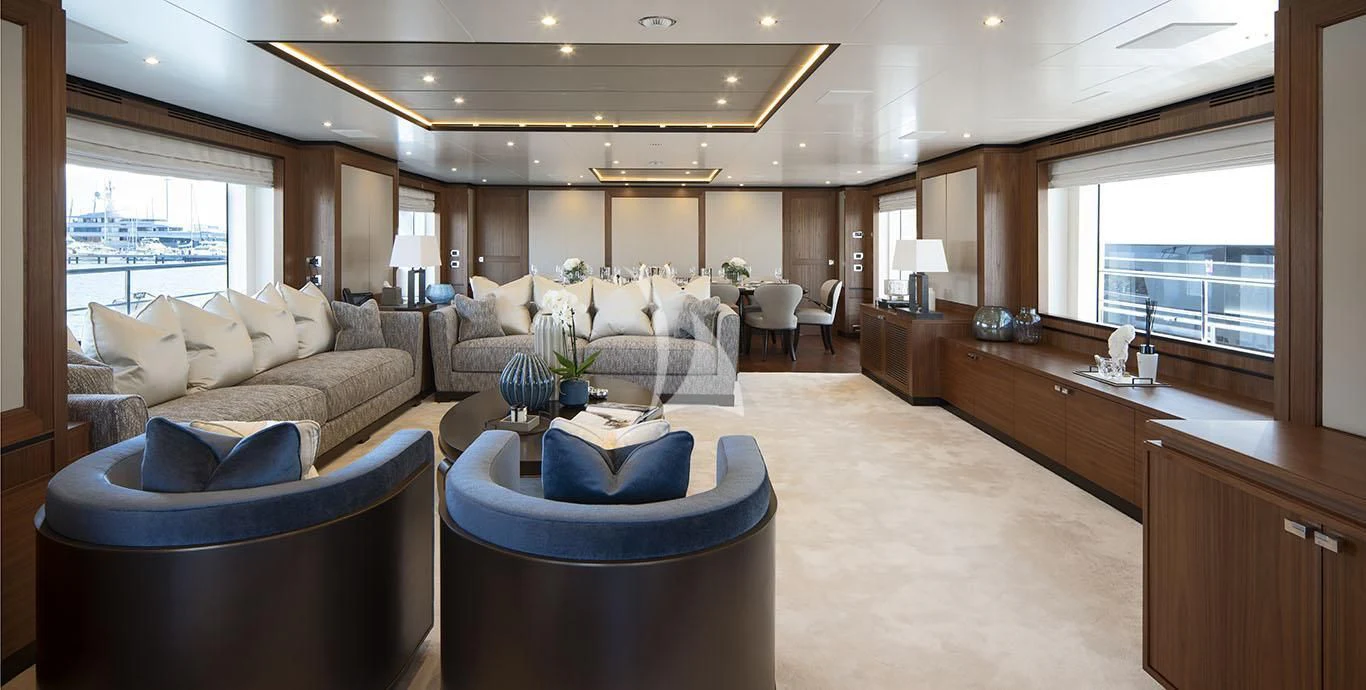 a living room with a large kitchen aboard RANIA Yacht for Sale