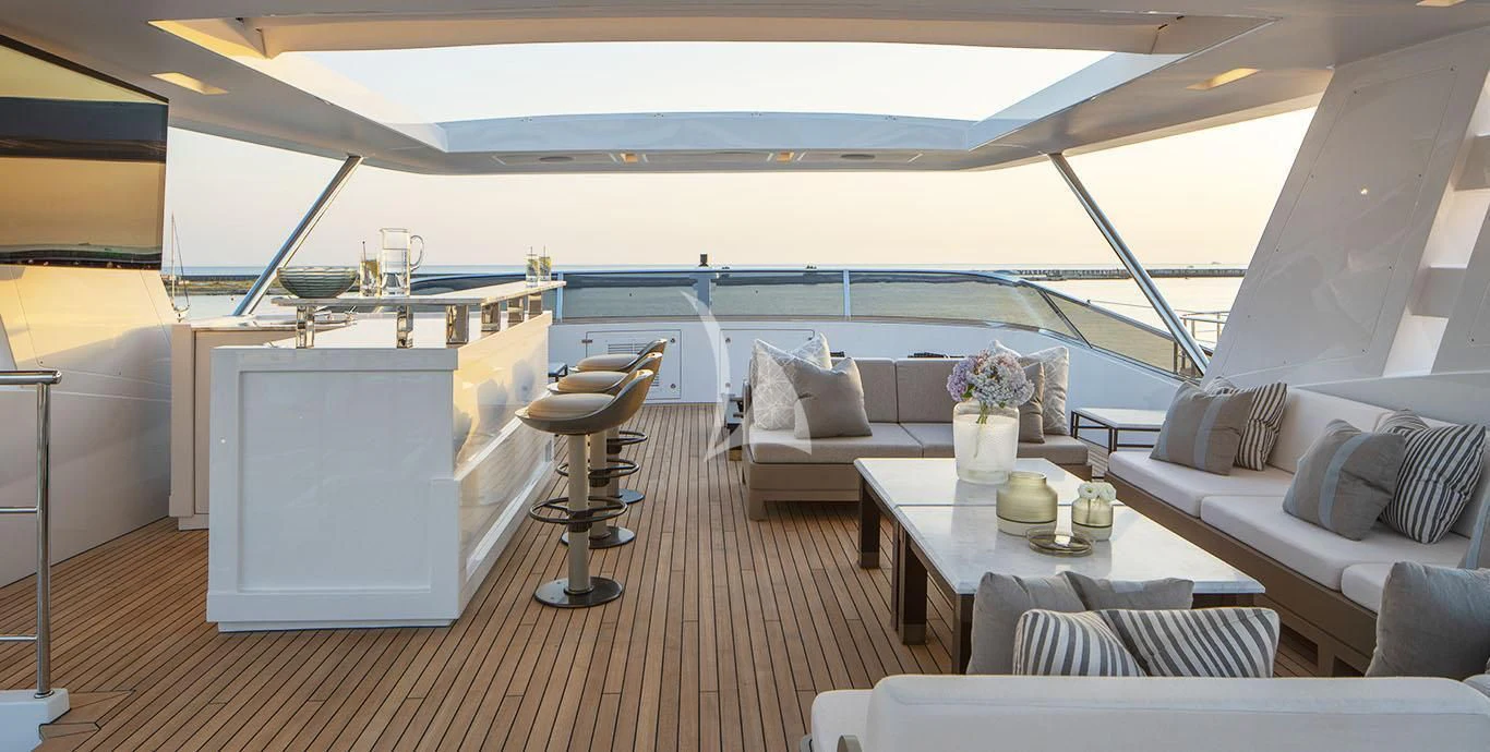a living room with a couch and a table aboard RANIA Yacht for Sale
