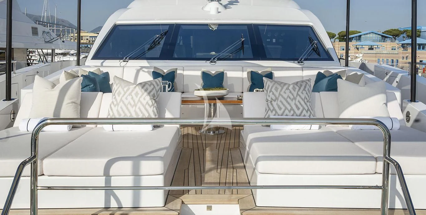 a white boat with white chairs aboard RANIA Yacht for Sale