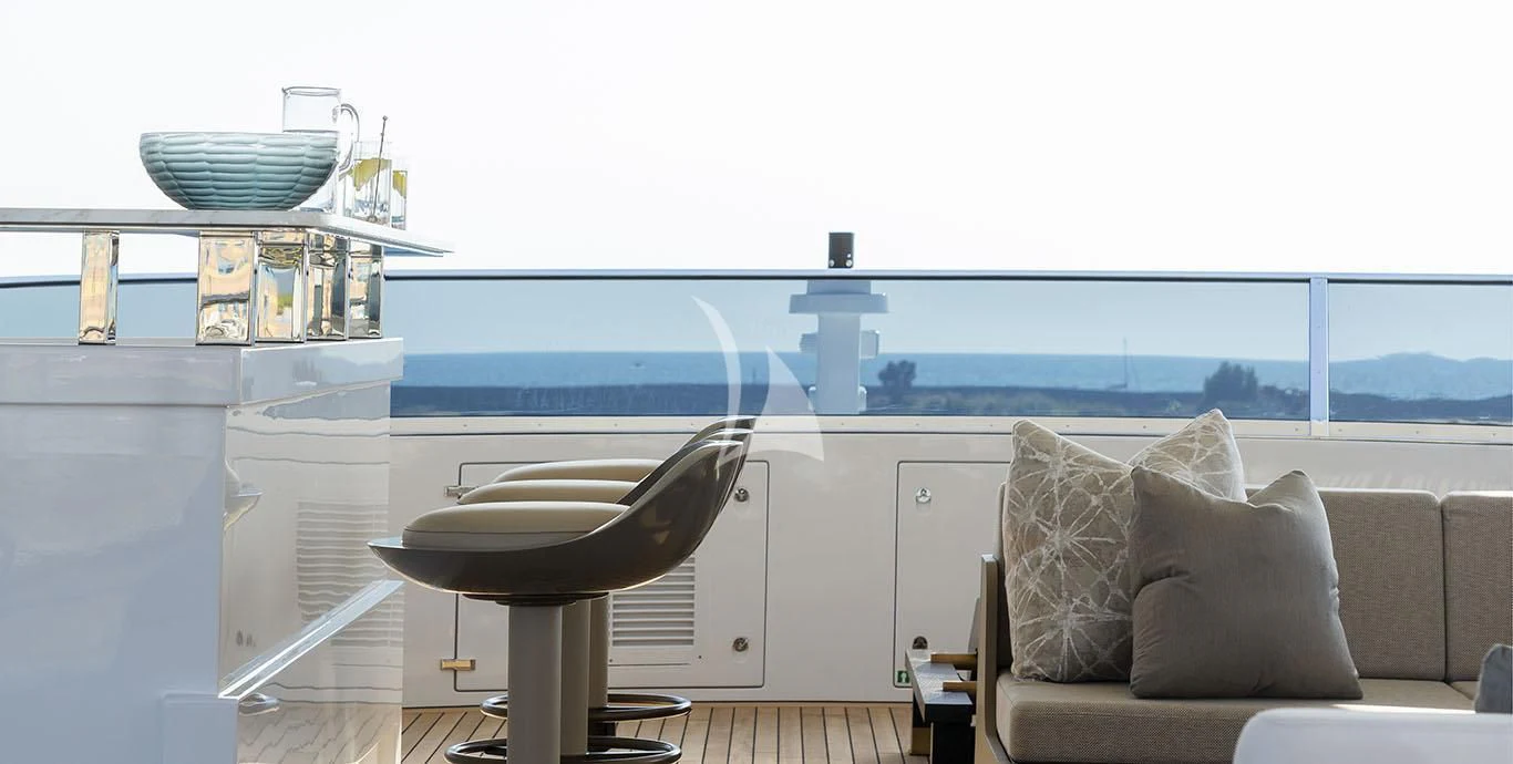 a room with a couch and a table and a chair aboard RANIA Yacht for Sale