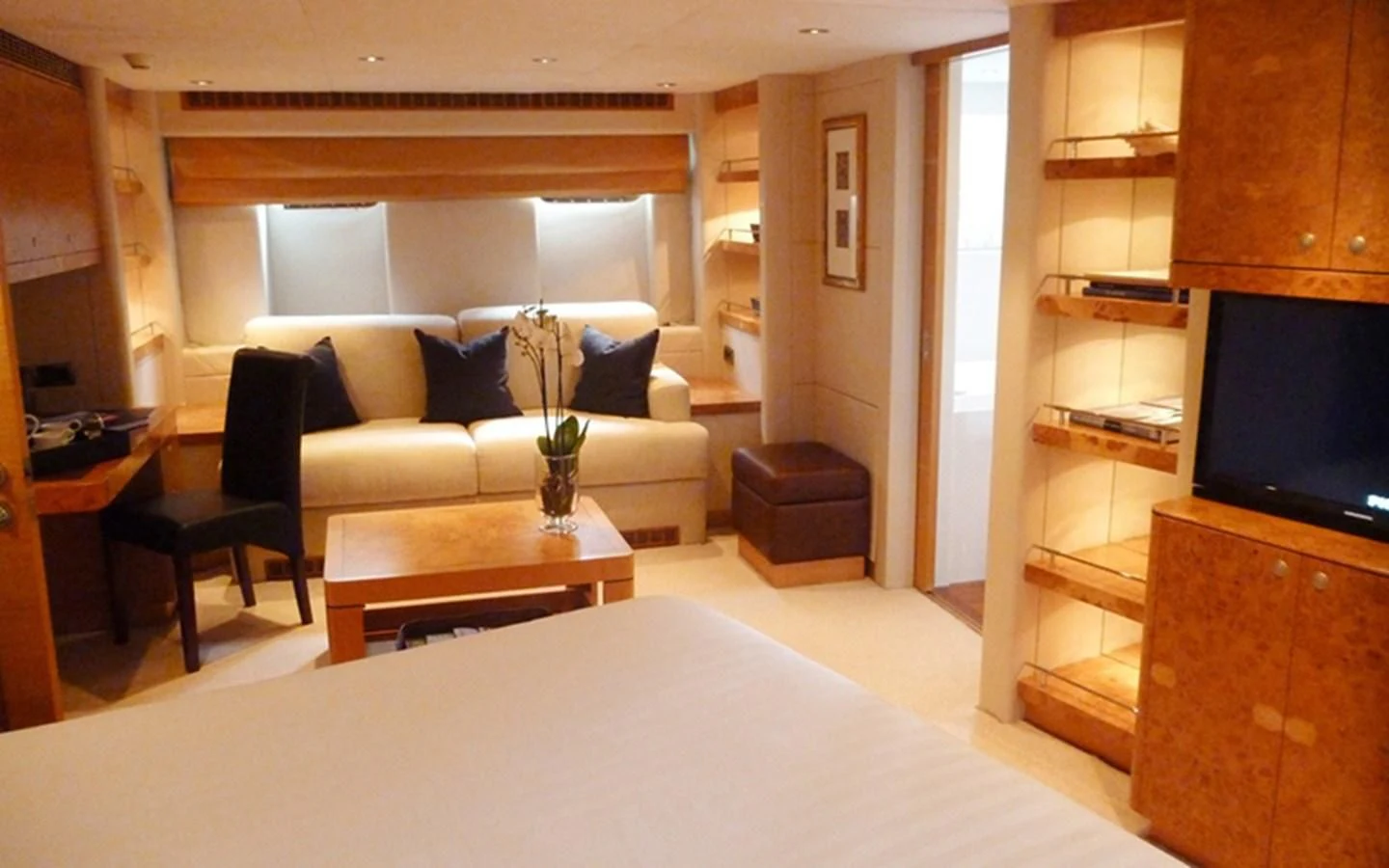 a living room with a couch and a tv aboard SUNNY HILL Yacht for Sale