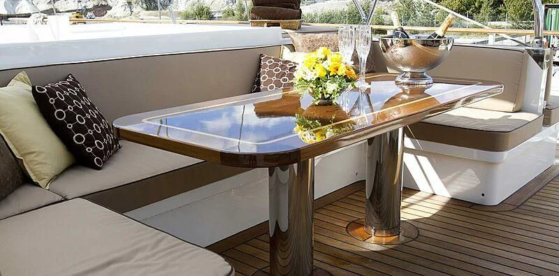a table with a vase of flowers on it aboard SUNNY HILL Yacht for Sale