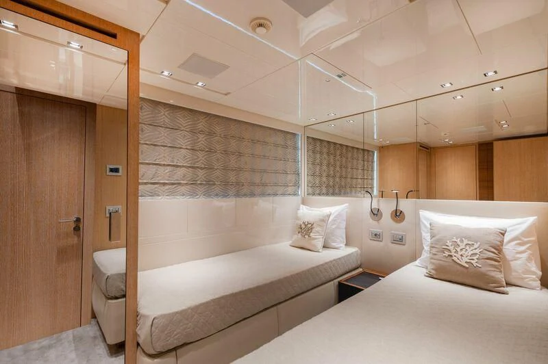 a room with two beds aboard VITTORIA I Yacht for Sale