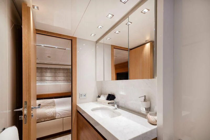 a bathroom with a sink and a mirror aboard VITTORIA I Yacht for Sale