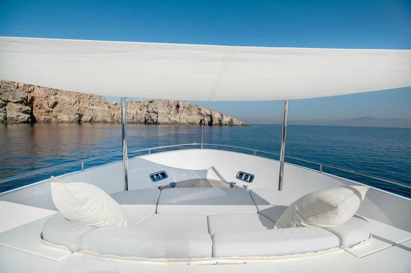 a white boat on a beach aboard VITTORIA I Yacht for Sale