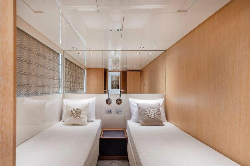 a room with two beds aboard VITTORIA I Yacht for Sale