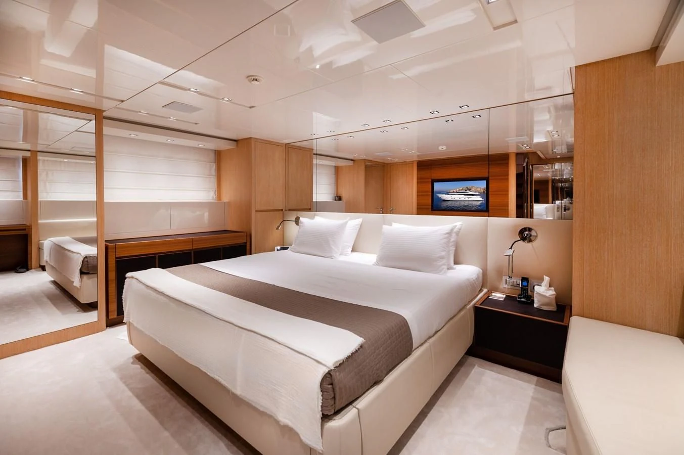 a large bed in a room aboard VITTORIA I Yacht for Sale