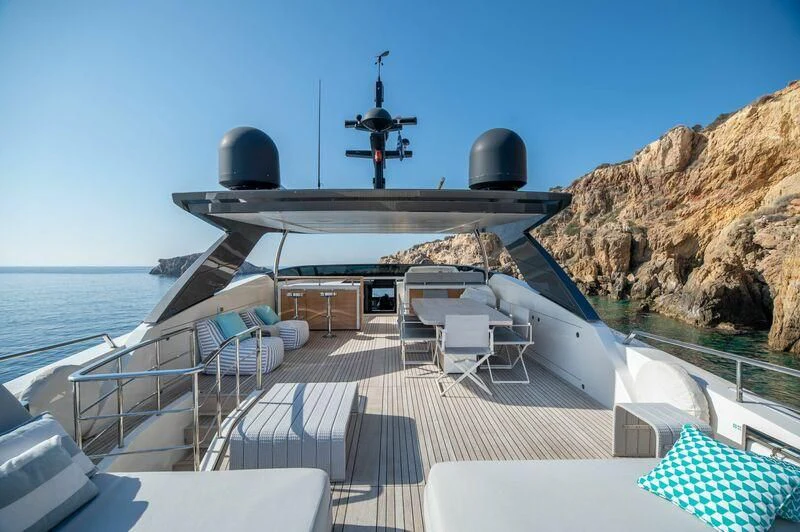 a deck with a large ship on it and a large ship in the water aboard VITTORIA I Yacht for Sale