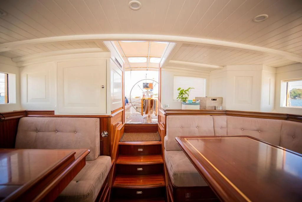 a room with a table and chairs aboard AURELIUS Yacht for Sale