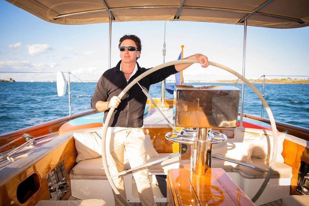 a man on a boat aboard AURELIUS Yacht for Sale