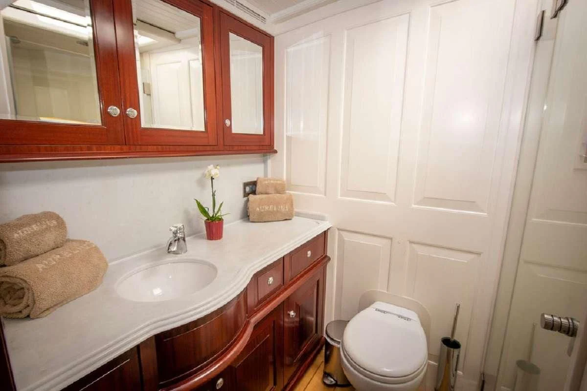 a bathroom with a sink and toilet aboard AURELIUS Yacht for Sale