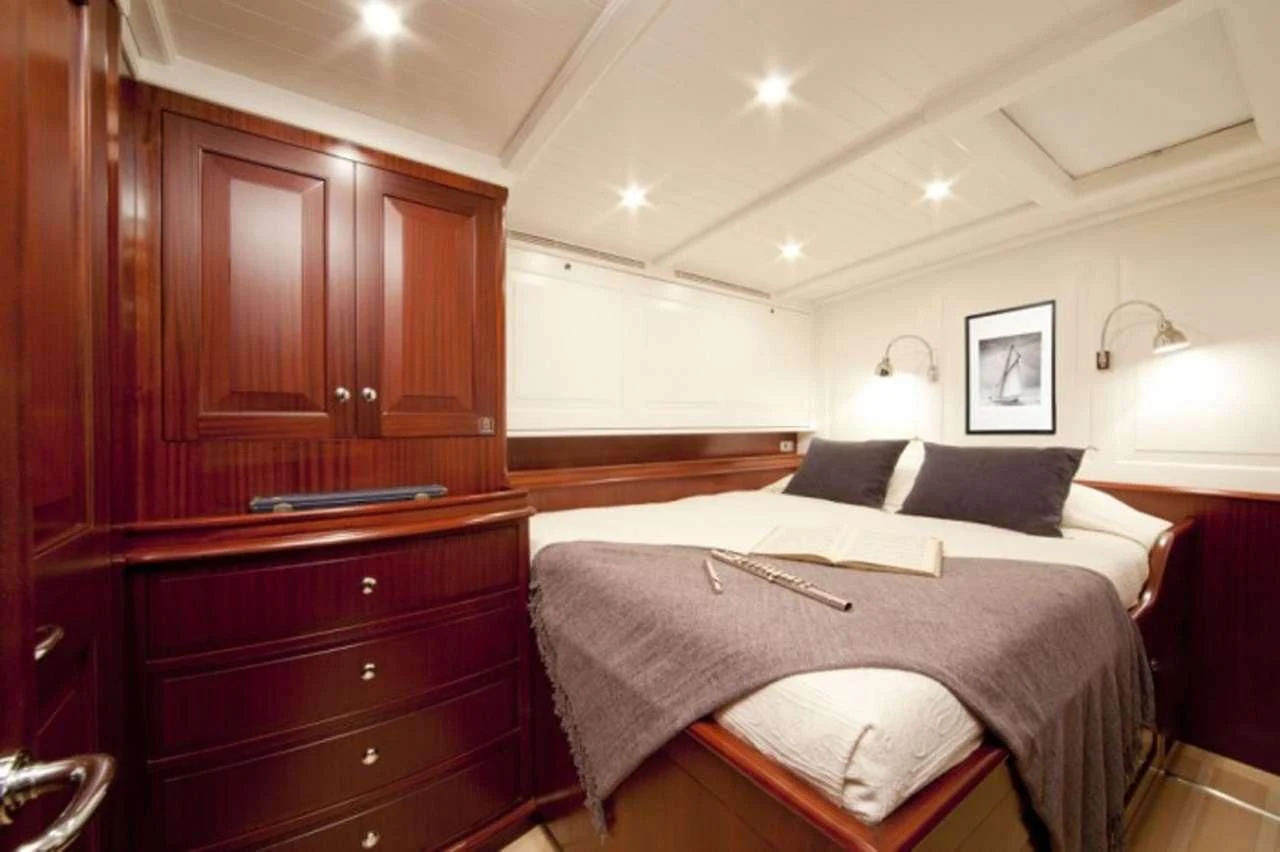 a bedroom with two beds aboard AURELIUS Yacht for Sale