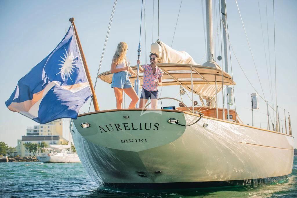 a couple of people on a sailboat aboard AURELIUS Yacht for Sale