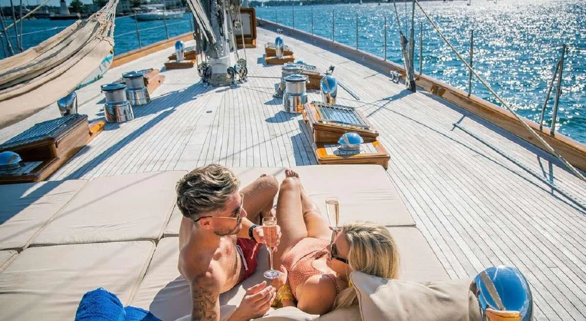a group of people on a deck aboard AURELIUS Yacht for Sale