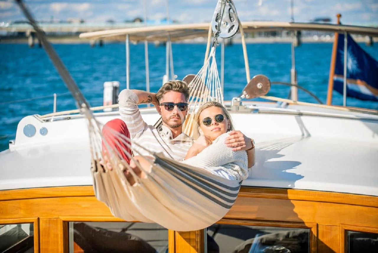 a man and woman on a boat aboard AURELIUS Yacht for Sale