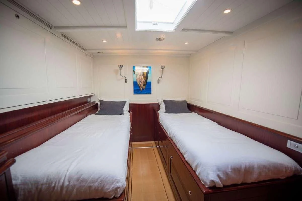 a room with two beds aboard AURELIUS Yacht for Sale