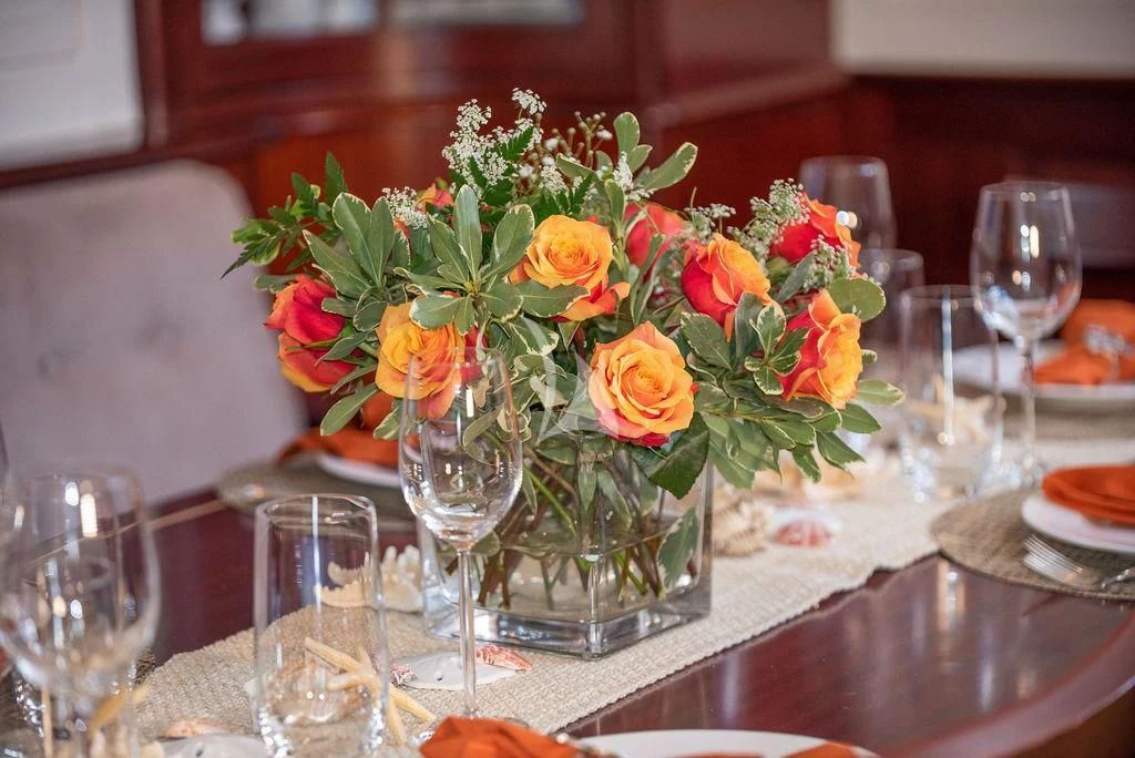 a vase of flowers on a table aboard AURELIUS Yacht for Sale