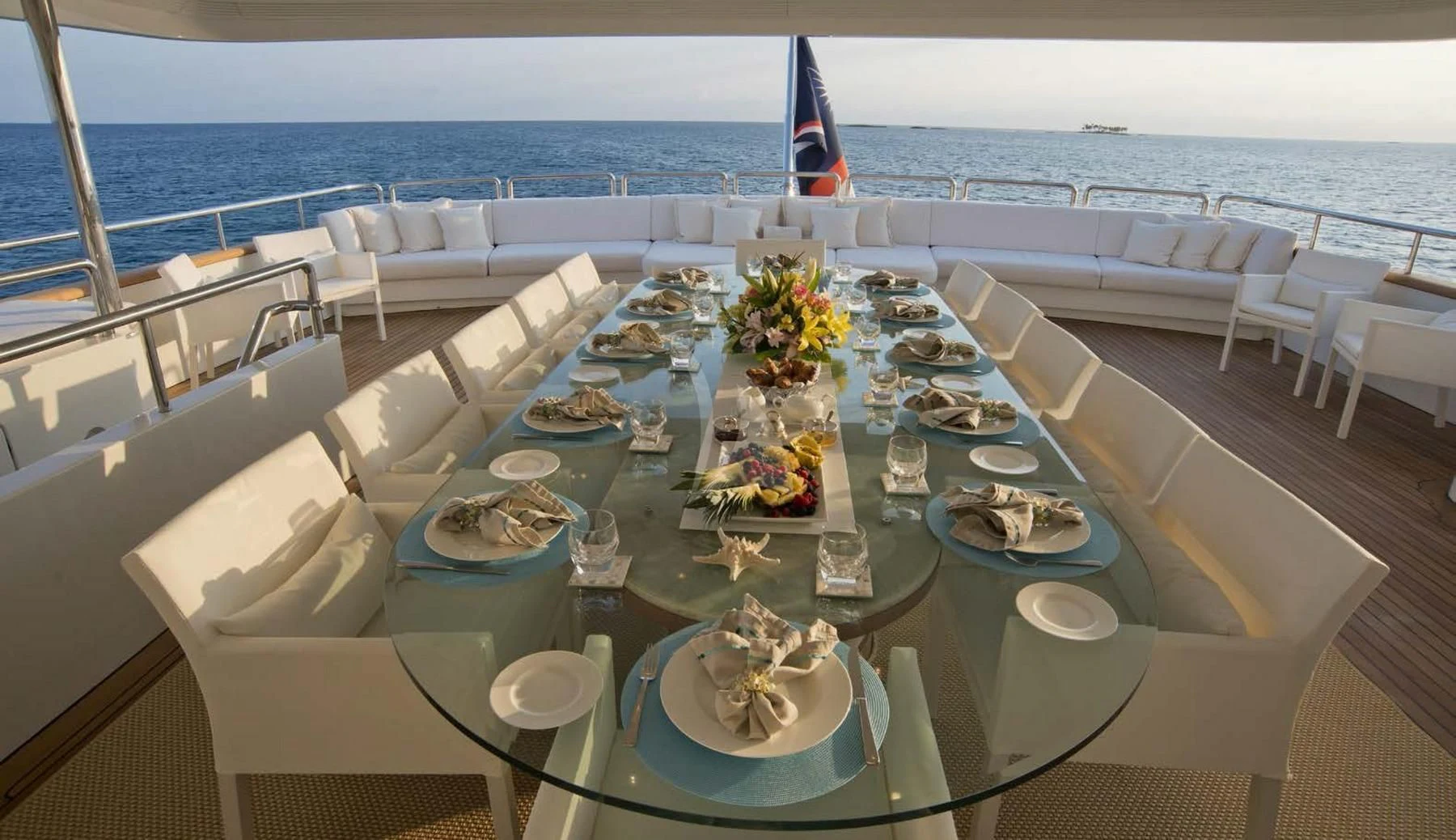 a table set for a dinner party aboard BARENTS Yacht for Charter
