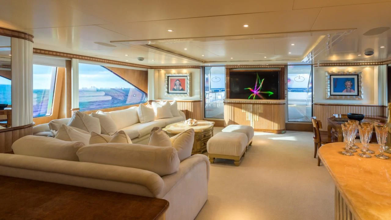 a living room with a large screen aboard BARENTS Yacht for Charter