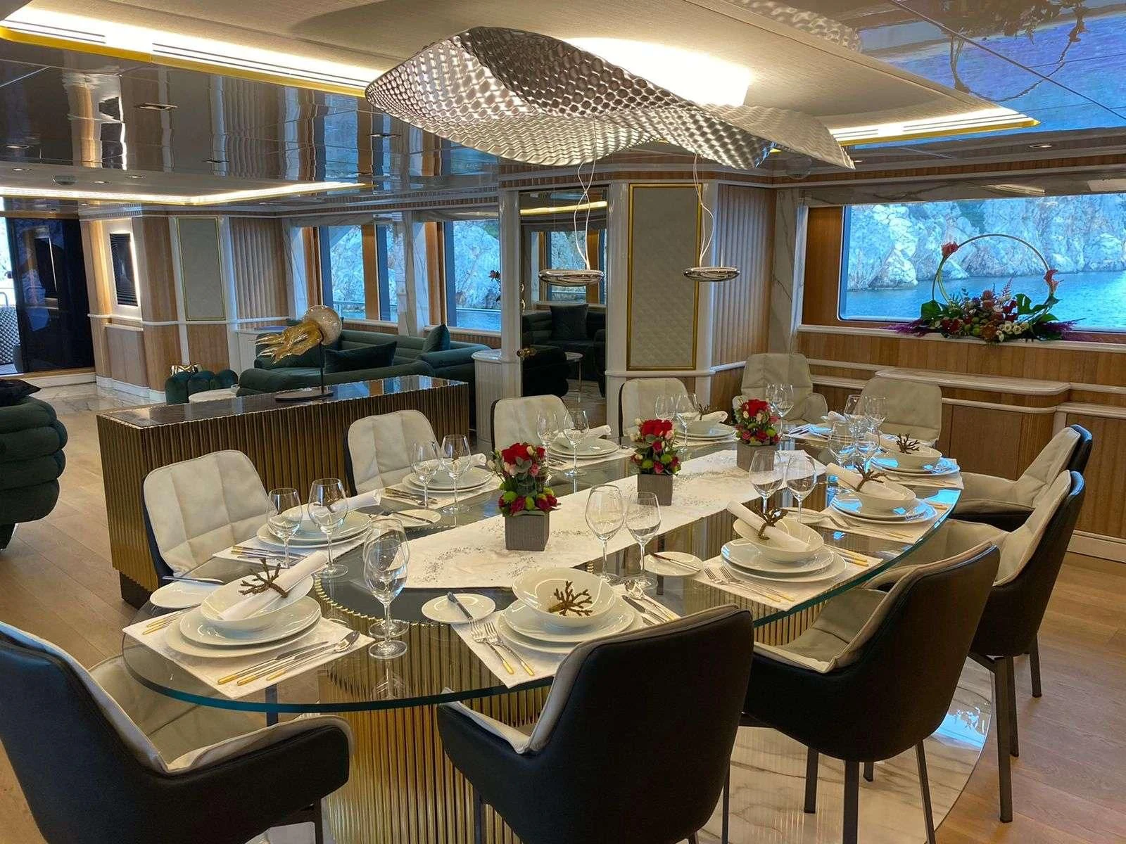 a large dining room with tables and chairs aboard BARENTS Yacht for Charter