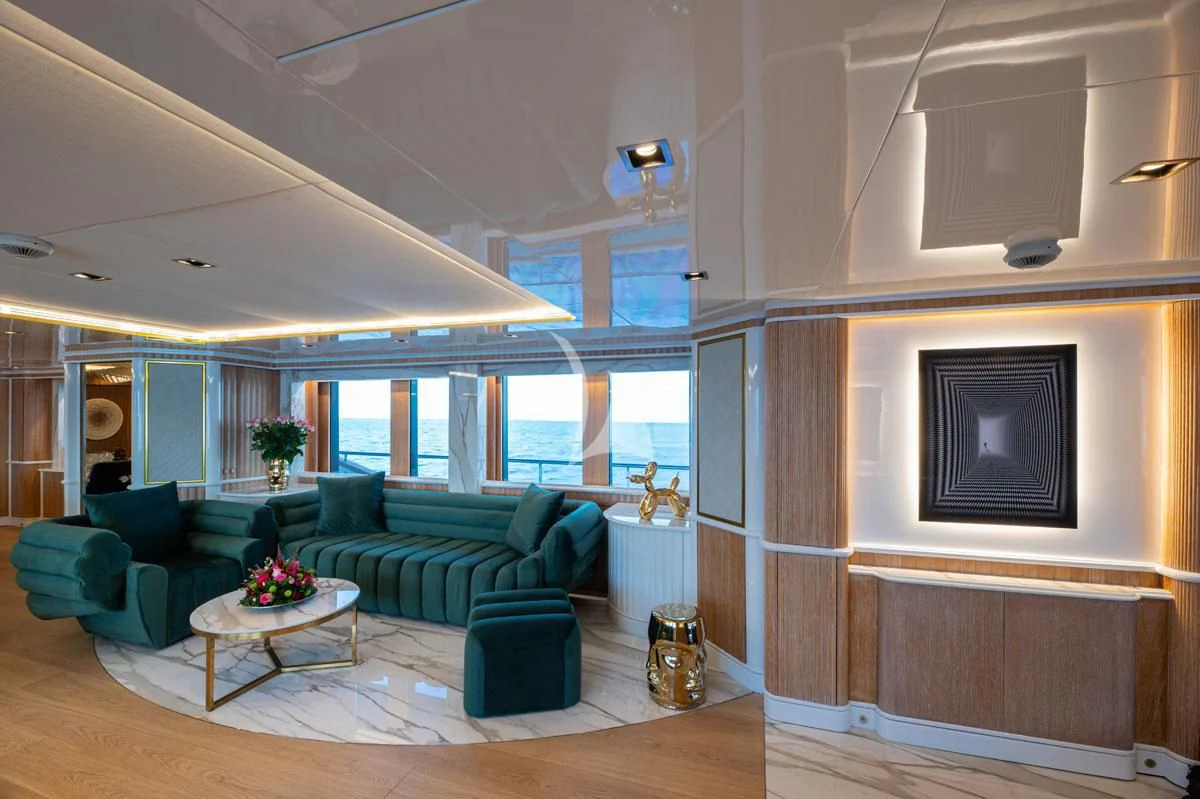 a living room with a couch and a table aboard BARENTS Yacht for Charter