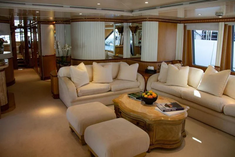 a living room with couches and a coffee table aboard BARENTS Yacht for Charter
