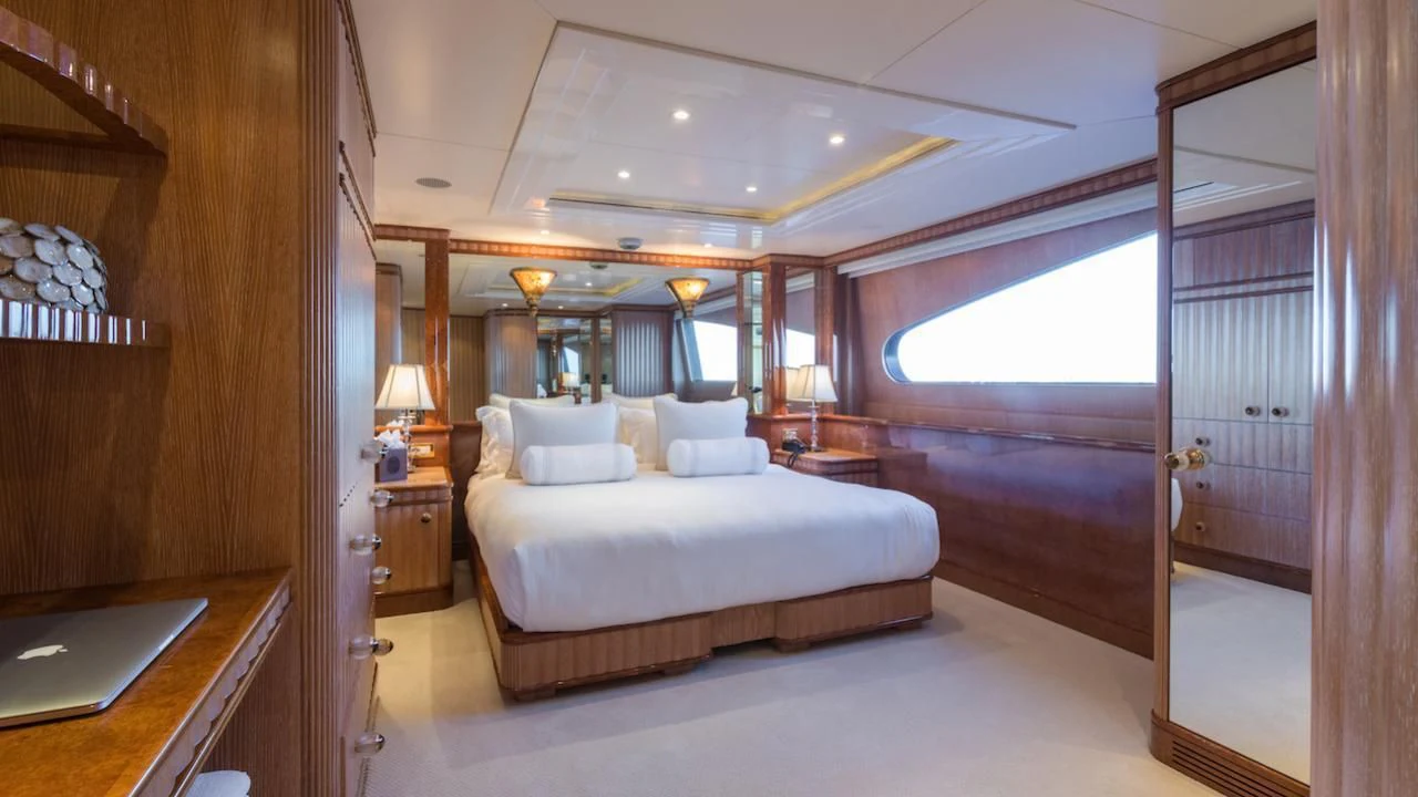 a large bedroom with a large bed aboard BARENTS Yacht for Charter