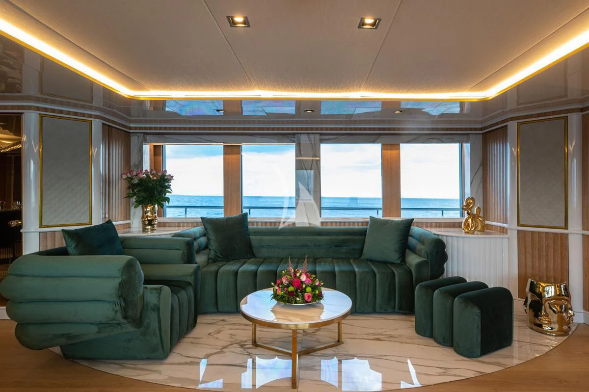 a living room with a couch and a coffee table aboard BARENTS Yacht for Charter