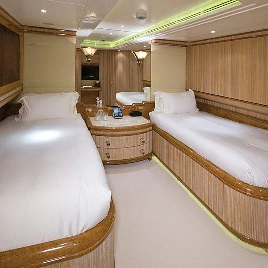 a room with a couple of beds aboard BARENTS Yacht for Charter