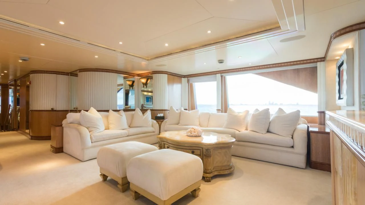 a living room with a couch and a table aboard BARENTS Yacht for Charter