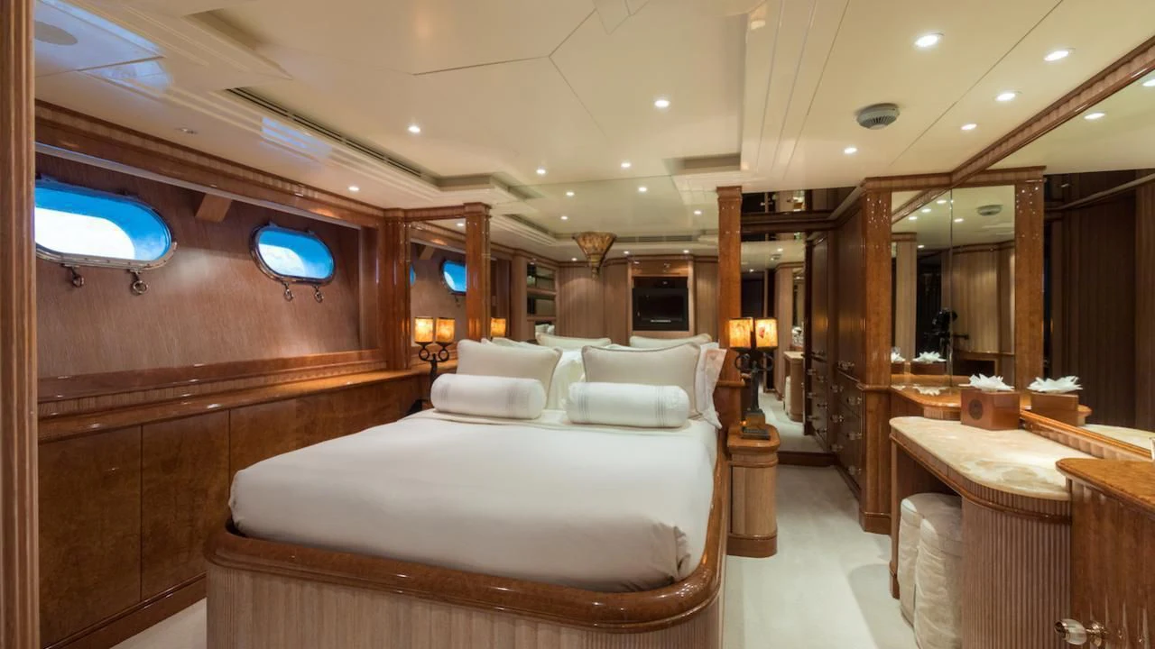 a room with a bed and a table aboard BARENTS Yacht for Charter