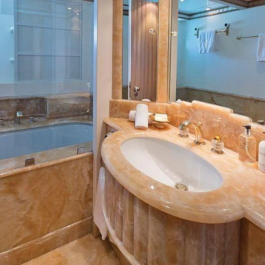 a bathroom with a sink and a bathtub aboard BARENTS Yacht for Charter