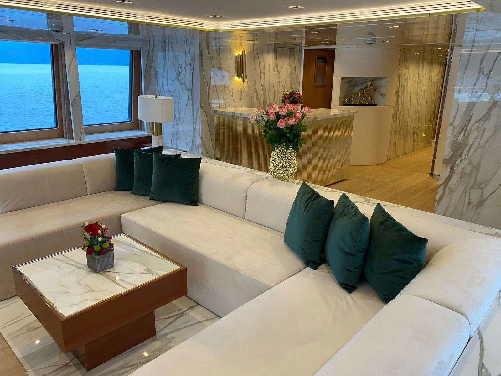 a living room with a couch and a table aboard BARENTS Yacht for Charter