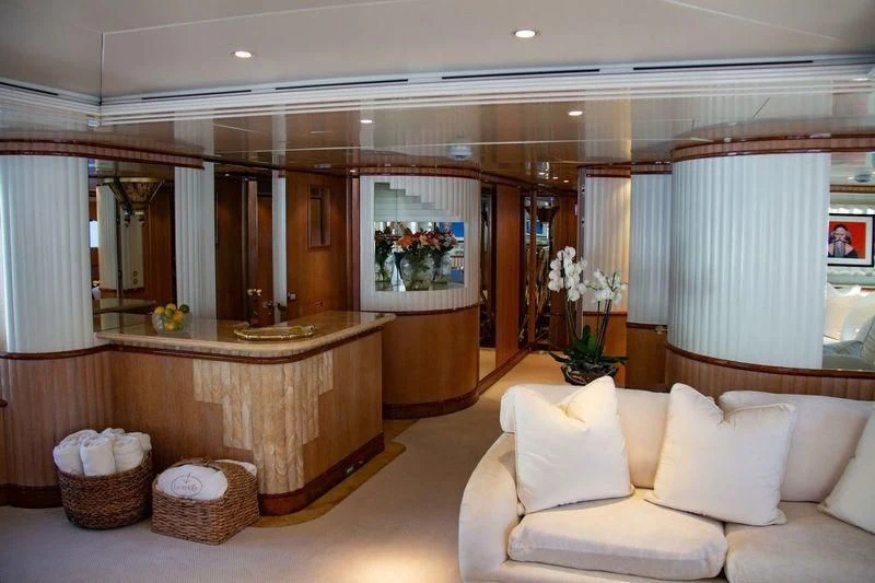 a large room with a large mirror and a couch aboard BARENTS Yacht for Charter
