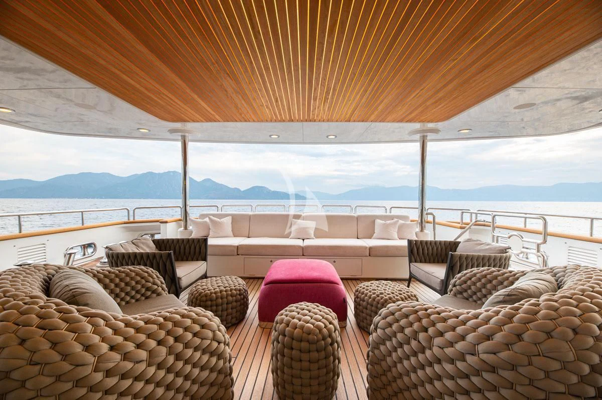 a patio with chairs and a table aboard BARENTS Yacht for Charter