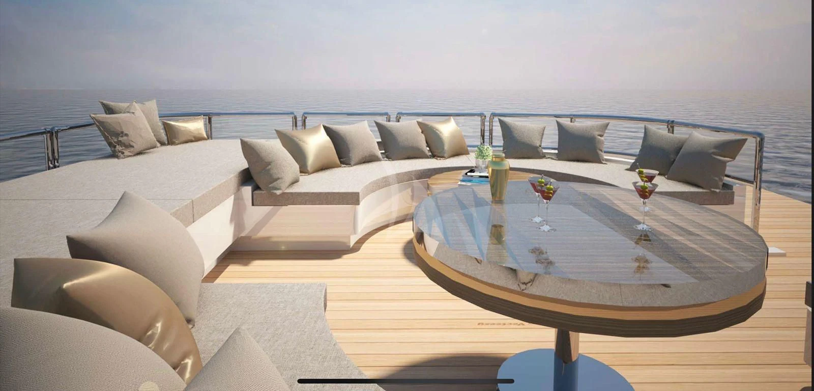 a large living room with a large sofa and a table with a glass of wine on it aboard BARENTS Yacht for Charter