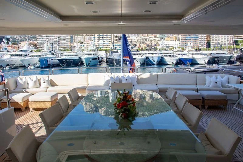 a room with chairs and tables aboard BARENTS Yacht for Charter