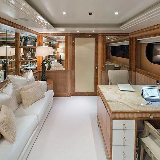 a large living room with a large kitchen and dining area aboard BARENTS Yacht for Charter