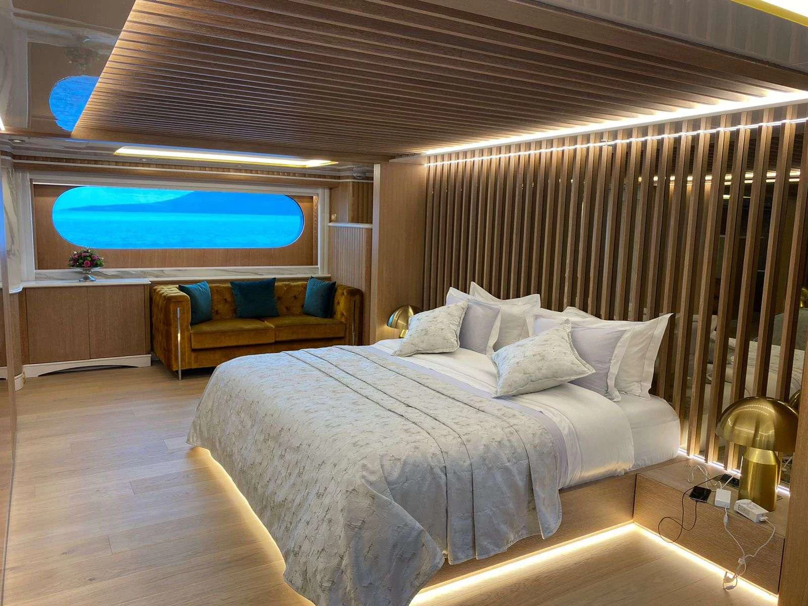 a bed with a large bed aboard BARENTS Yacht for Charter